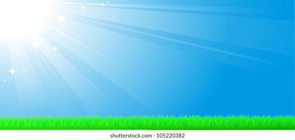 blue sky background with sun beam, green grass and space for text