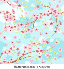 blue sky with branches blossom of cherry. seamless texture for fabric