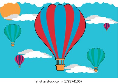 Blauer Himmel mit weißen Wolken, bunter Heißluftballons