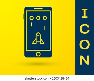 Blue Smartphone and playing in game icon isolated on yellow background. Mobile gaming concept.  Vector Illustration