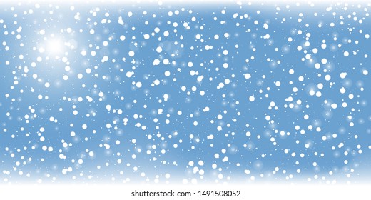 Blue snow background. Winter sky. Merry Christmas. Light blue space background. New year. Cold season. Falling snow.