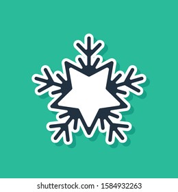 Blue Snowflake icon isolated on green background. Merry Christmas and Happy New Year.  Vector Illustration