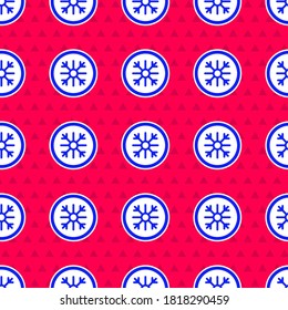 Blue Snowflake icon isolated seamless pattern on red background.  Vector