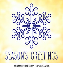 Blue snowflake over square abstract smooth blur background with hand written season's greetings.