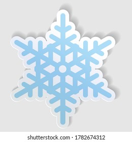 Blue snowflake sticker, icon. Vector illustration isolated on gray background.