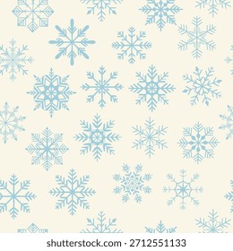 Blue snowflakes on a light background, the colors of the year. Seamless Christmas pattern. Winter holiday concept. Repeatable design for decor, wallpaper, packaging, and websites.