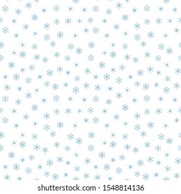 Blue snowflakes on a white background. Seamless texture of snowflakes.