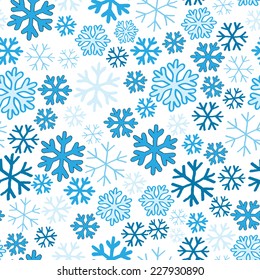 Blue  snowflakes on white background seamless pattern