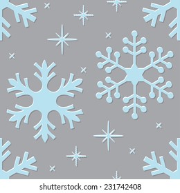 Blue snowflakes over gray background seamless pattern.
