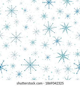 Blue snowflakes seamless pattern. Repetitive christmas background for winter holidays.