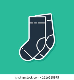 Blue Socks icon isolated on green background.  Vector Illustration