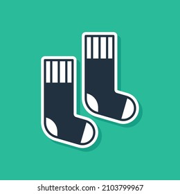 Blue Socks icon isolated on green background.  Vector