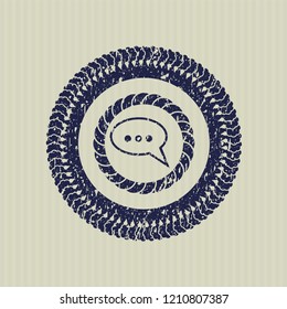 Blue speech bubble icon inside distress rubber seal