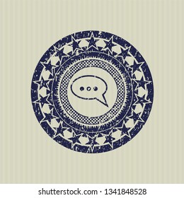 Blue speech bubble icon inside distressed rubber grunge stamp