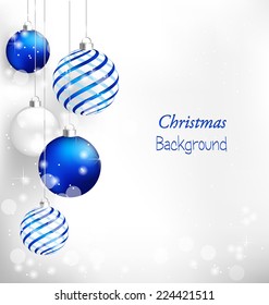 Blue spiral christmas balls hang on white background