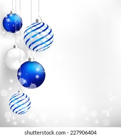 Blue spiral christmas balls hang on white background