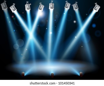 A blue spotlight background concept with lots of lights like spotlights in a light show or during a dramatic theatre stage performance