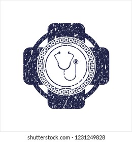 Blue stethoscope icon inside distress rubber grunge texture stamp