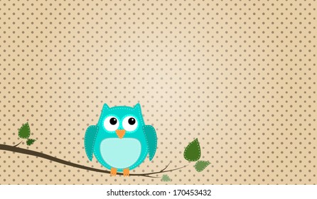 Blue stitched owl sitting on a branch with a polka dot background
