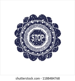 Blue stop icon inside distress rubber stamp