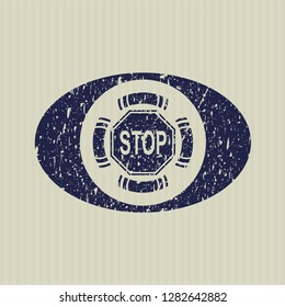 Blue stop icon inside distress rubber grunge stamp
