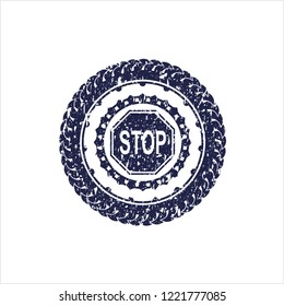 Blue stop icon inside grunge seal