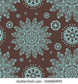 blue stylish ethnic pattern from feathers and kircles on a brown background