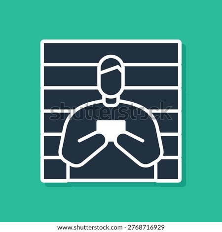 Blue Suspect criminal icon isolated on green background. The criminal in prison, suspected near the board.  Vector Illustration