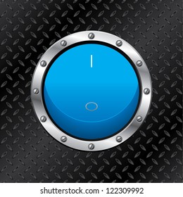 Blue switch with metallic ring on dark plate background