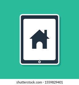 Blue Tablet and smart home icon isolated on green background. Remote control.  Vector Illustration