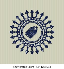 Blue tag icon inside rubber stamp with grunge texture