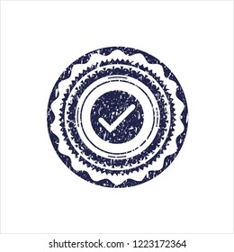 Blue tick icon inside distress rubber seal with grunge texture