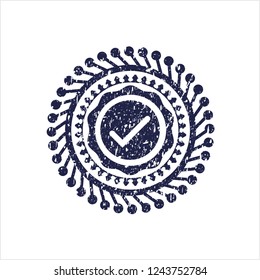 Blue tick icon inside grunge seal