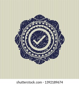 Blue tick icon with rubber seal texture