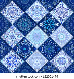 Blue tile seamless pattern. Luxury floral patchwork background. Mandala boho decoration. Intricate flower ornament. Square design elements. Portuguese moroccan motif. Unusual oriental flourish print.
