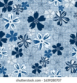 Blue tinted flowers of various sizes on a dotted background vector seamless surface pattern for home decor, scrapbooking and various backgrounds.