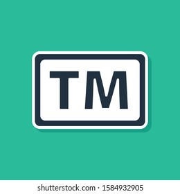 Blue Trademark icon isolated on green background. Abbreviation of TM.  Vector Illustration