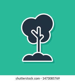 Blue Tree in the ground icon isolated on green background. Forest symbol.  Vector Illustration