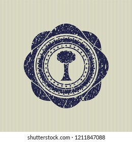 Blue tree icon inside distressed rubber grunge stamp