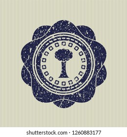 Blue tree icon inside rubber seal