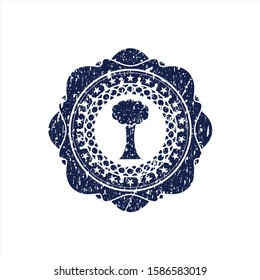 Blue tree icon inside rubber grunge seal