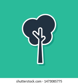 Blue Tree icon isolated on green background. Forest symbol.  Vector Illustration