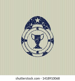 Blue trophy icon inside distress rubber seal