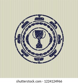 Blue trophy icon inside distressed grunge stamp