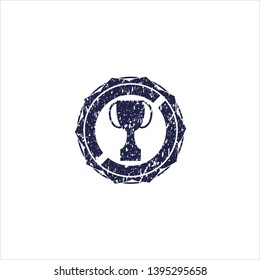 Blue trophy icon inside rubber seal with grunge texture