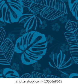 Blue tropical leaves pattern. Tropical seamless pattern with white leaves of monstera, banana and palm trees on a blue background.