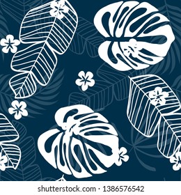 Blue tropical leaves pattern. Tropical seamless pattern with white leaves of monstera, banana and palm trees on a blue background.