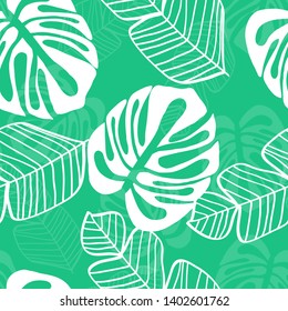 Blue tropical leaves pattern. Tropical seamless pattern with white leaves of monstera, banana and palm trees on a blue background.