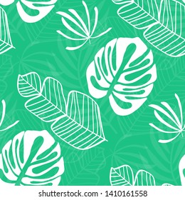 Blue tropical leaves pattern. Tropical seamless pattern with white leaves of monstera, banana and palm trees on a blue background.