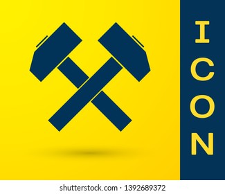 Blue Two crossed hammers icon isolated on yellow background. Tool for repair. Vector Illustration